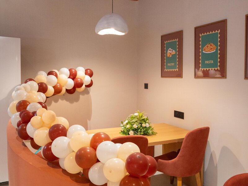 Comfortable seating arrangements and beautiful interior decor at Aristo Cafe Ahmedabad